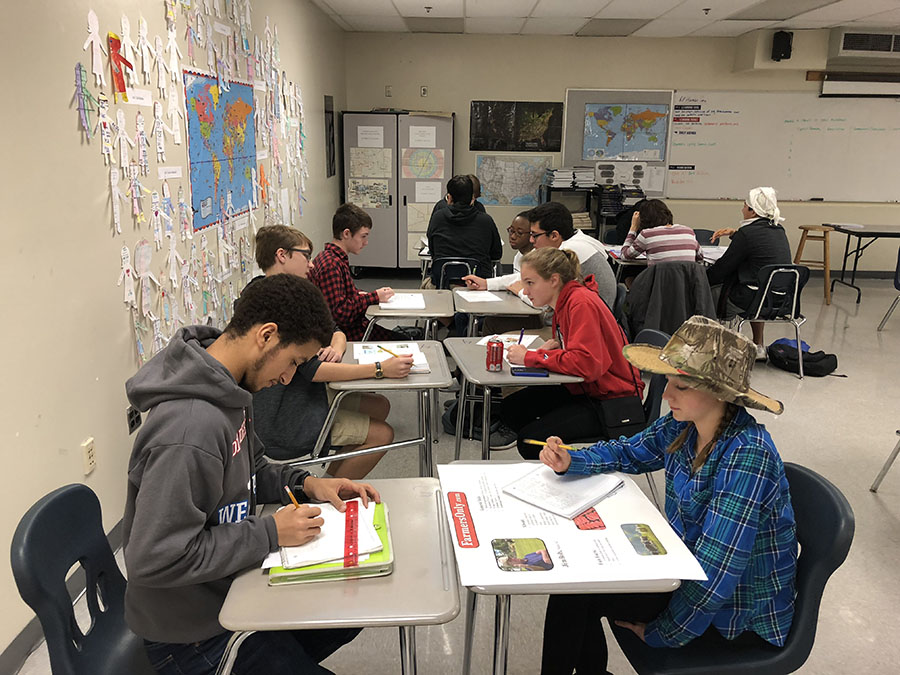 Students in Carrie Foster’s AP Human Geography “speed date” while learning about their classmates’ assigned farming type. Each student was given a farming style to research and was expected to come to class with a poster about that farming style.