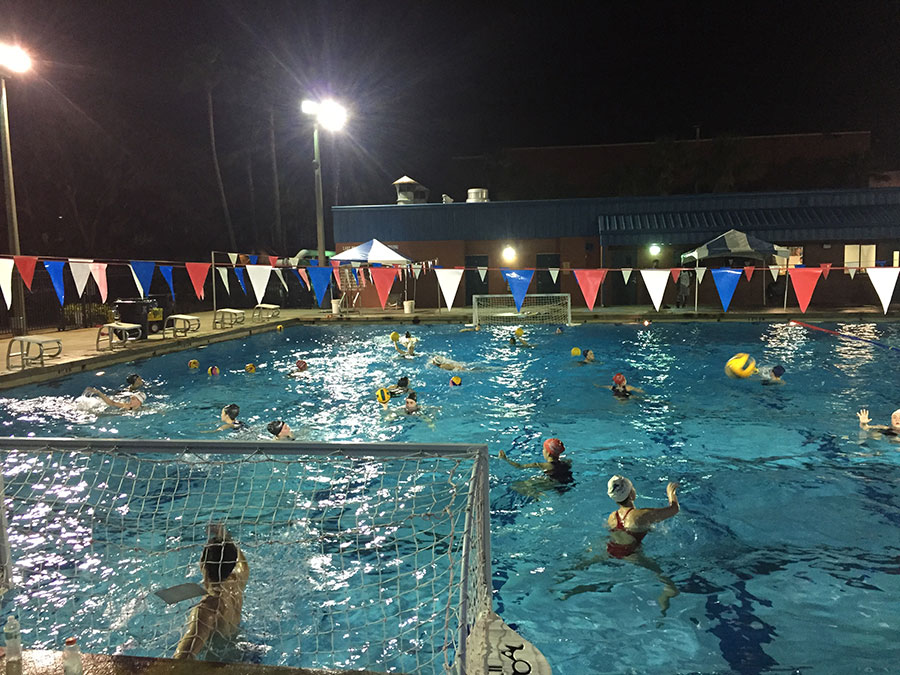 At the James M. Sprinkle Aquatic Center, the club water polo team practices on Thursday night, Jan. 11 Center. During the practice, the team members ran drills to prepare themselves for the upcoming tournament on Saturday the 13th . “It's through practice that we teach them how to put themselves into opportunistic positions and then how to capitalize when those opportunities arise in games,” varsity water polo coach Matt Tomlinson said.