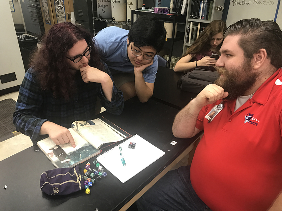 After school on Friday, Feb. 16 students Jonathon So and Jacob Plummer explain popular board game