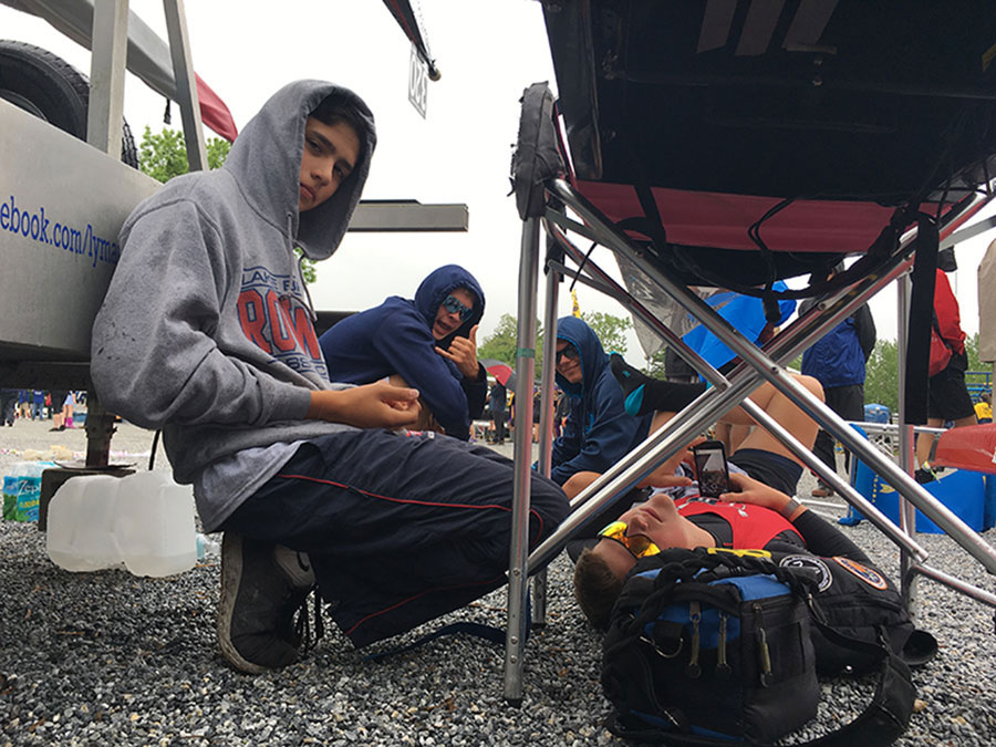 On the morning of Time Trials, which determines who goes to Semi-Finals, (only the top 12 from Time Trials will proceed), sophomore Mason Walton, junior Brett Feldman, junior Brandon Vick, and junior Logan Turner, who make up LBRA Men’s Junior 4 (J4), sits by their boat,