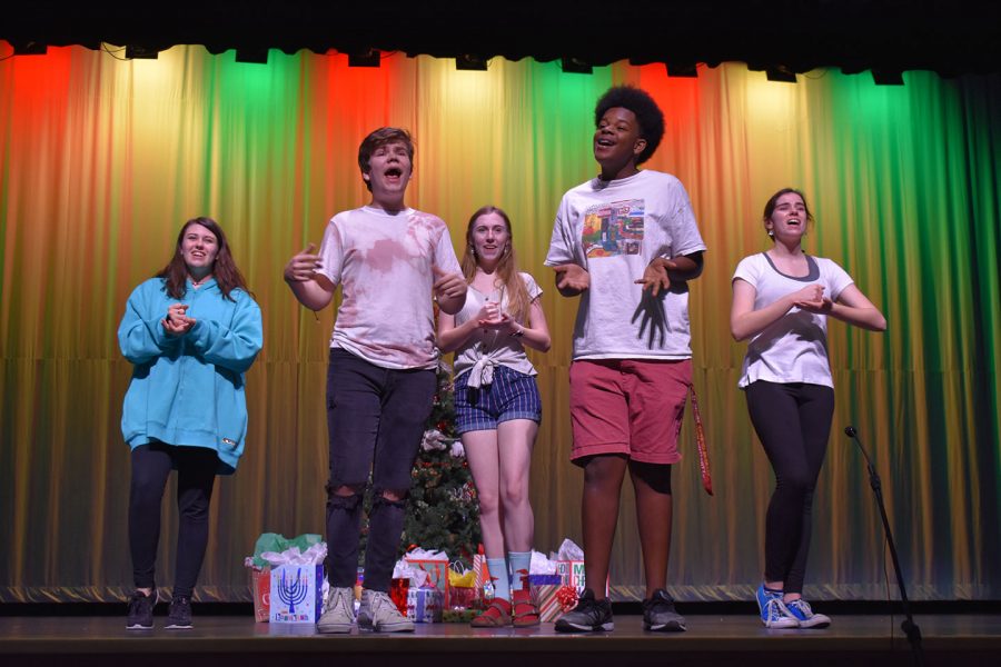 Leah Sommerio (sophomore), Jacob Shoemate (junior), Alicia Steffy (senior), Avery Lewis (senior), and Kyra Martin (sophomore) rehearse their group number “Merry Almost Christmas”. “Everyone kind of had their own acts to work on and they were able to make it their own and perfect it,” Lewis said. “It made for a really good show at the end!”