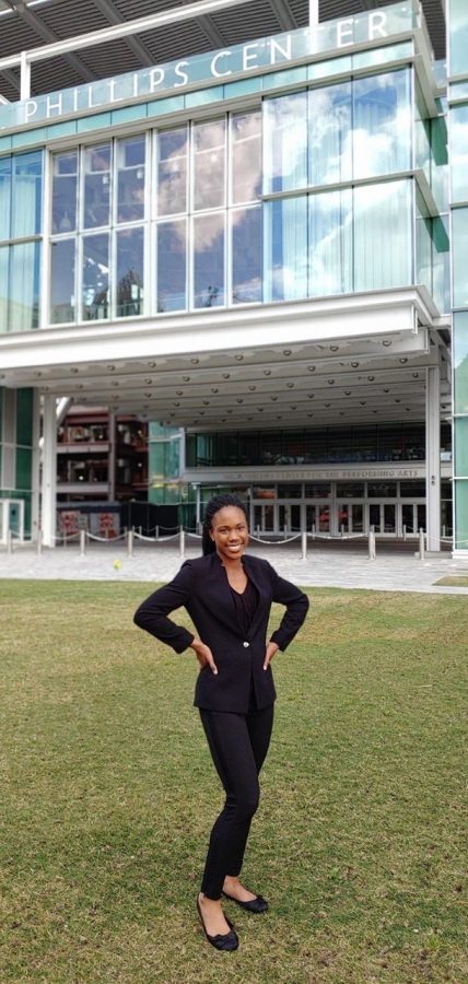 Junior Amilyah Robinson poses outside of the Dr. Phillips Center for Performing Arts. Robinson played for “Peter in the Wolf” in 2018. In our last show the house was completely full, it was so great to see the audience just staring at you down in the pit. Robinson said. 