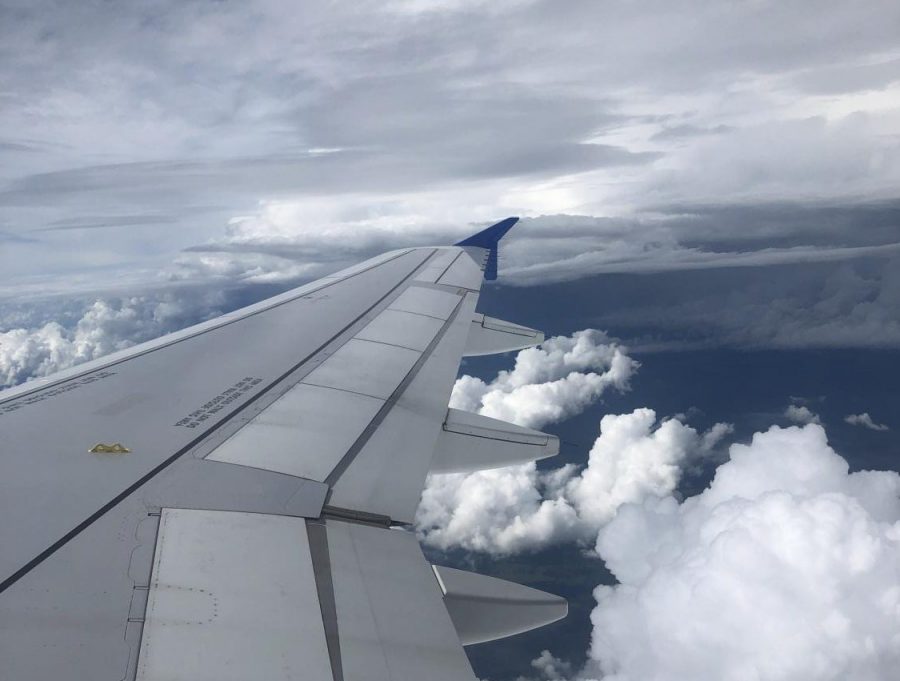 On board an Allegiant airline flight to Appleton, Wis., journalism teacher Katie Turkelson watches the clouds float by from her window seat. Turkelson considers herself a window Sleeper. 