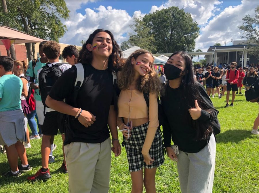 Sophomores Angel Alvarez and Areana Sanchez pose with Elise Templo to show off their Colombian and Puerto Rican heritage with face-painted flags at the Hispanic Heritage festival during A Lunch.