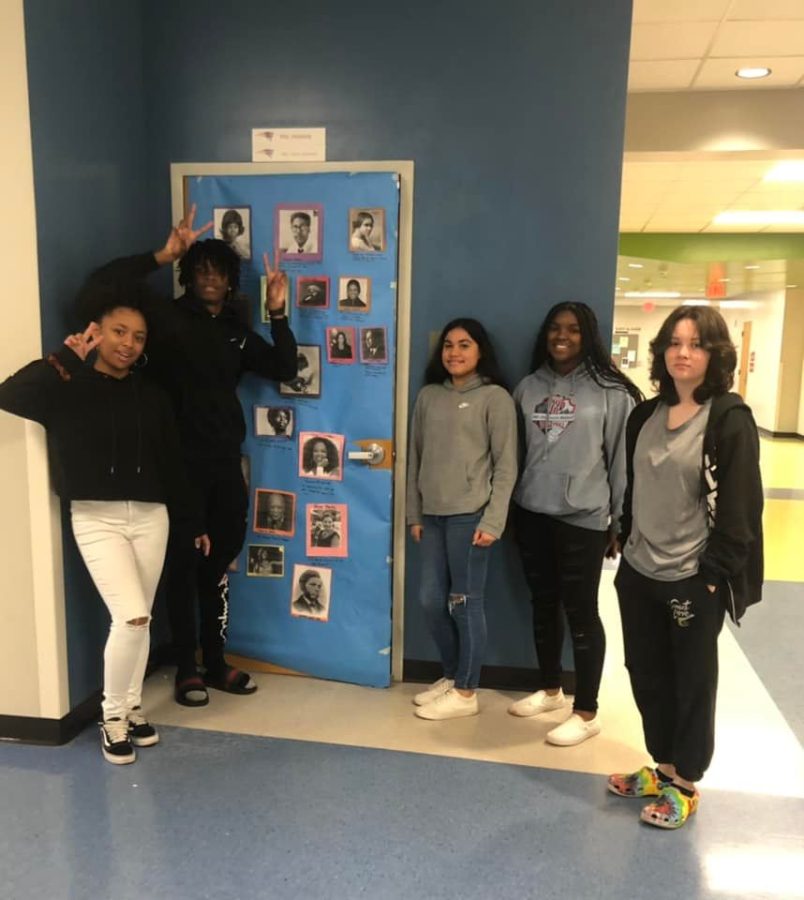 Students present their entry to the Black Student Unions (BSU) door decorating contest. The doors celebrate Black History Month, honoring the historic achievements that generations of African Americans have made.