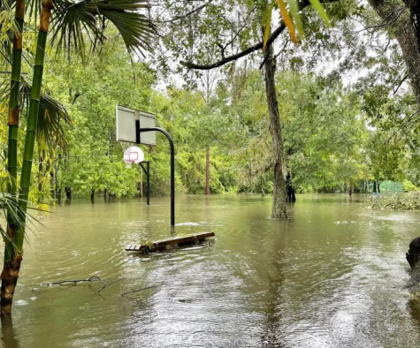 Reeling from the effects of Hurricane Ian, once playable basketball courts are found submerged in water. 