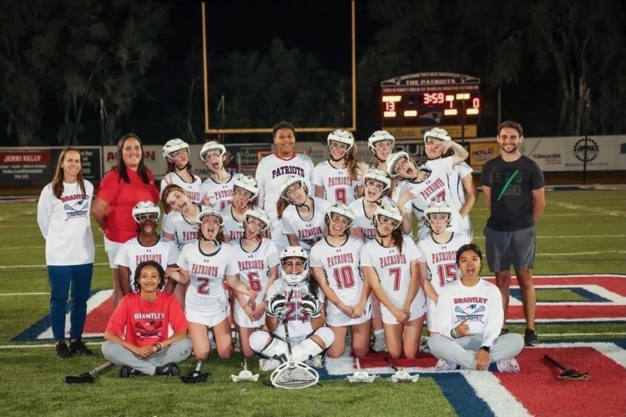 The varsity girls lacrosse team poses for a silly picture. The girls season ended with a record of 19-6.