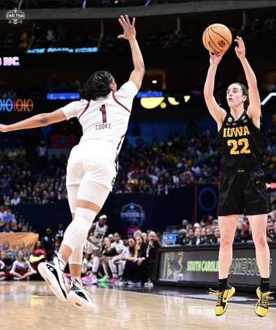 Caitlin Clark shoots contested three-pointer over South Carolinas Zia Cooke. Her unique skill has led her to gain a fanbase.