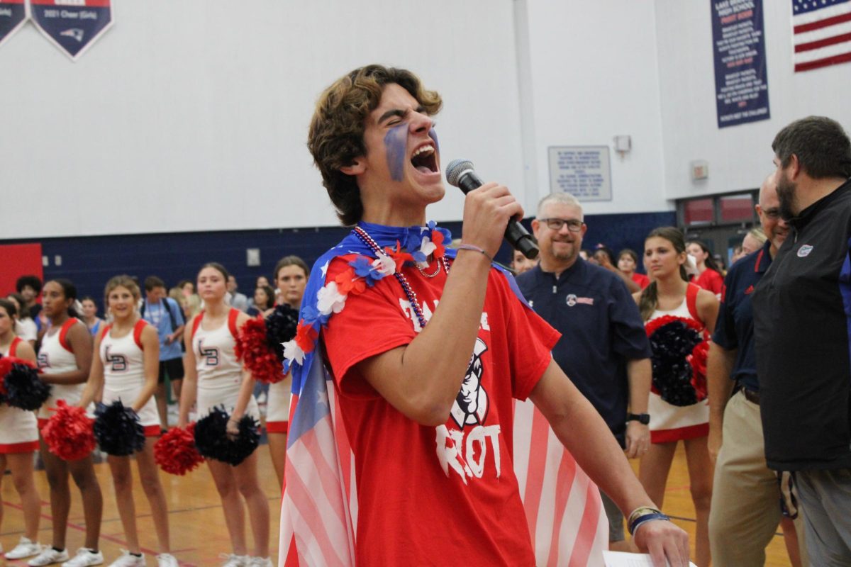  The newly appointed ‘King of the Student Section’ Carson Homitz starts off the pep rally strong with his passionate entrance speech. Later that day he would lead the student section in cheers, chants and other traditions in support of the football team.