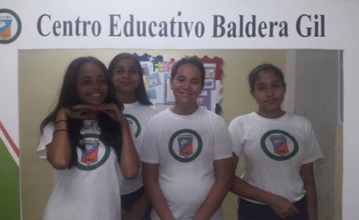 Freshman Sharline Belliard and peers pose for a “student memory” photo at their school in Santiago De Los Caballeros, Dominican Republic. “I think it’s nice to take pictures from school,” Belliard said. “When you get older you can see all the memories you had.”