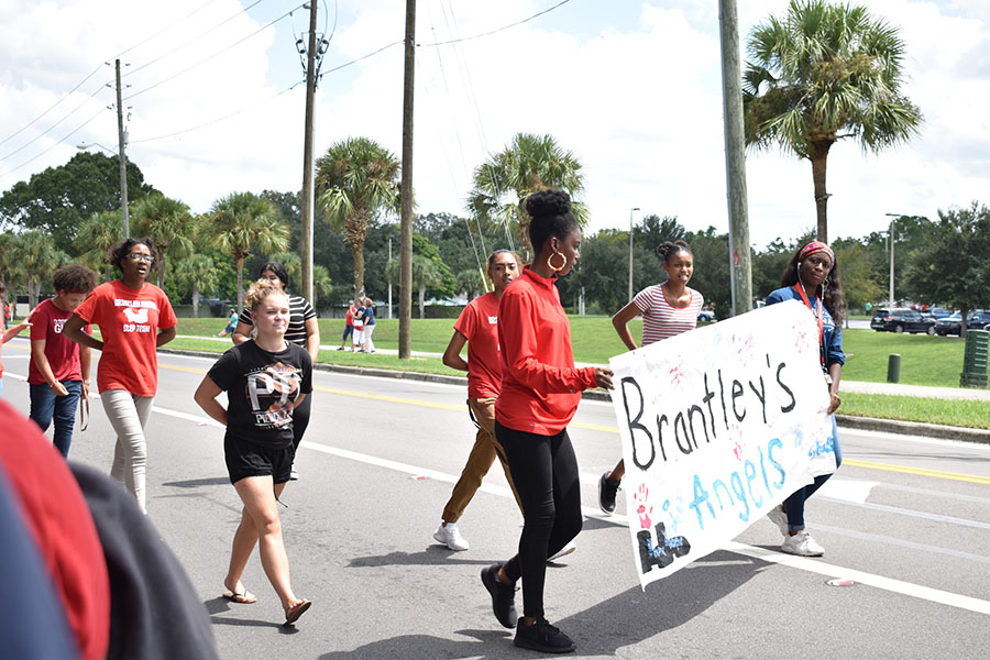 The Lake Brantley Step team marches their way through the parade. Friday September 7 they did different steps throughout the parade.