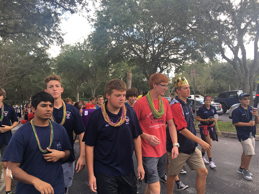 Jai Malik, Jacob Thomaston, Kyle Haight, Max Moltzan and Brandon Vick walk in a line at the start of the parade. Getting ready for the short, but exciting parade.