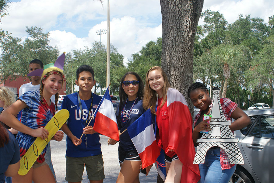 French Club prepares their props in the student parking lot as they wait for the parade to start on September 7th. The props were used in order to aspects of French Culture.
