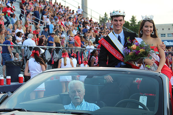 Seniors Matt Little and Jessica Powell prepare for a ride around the Tom Storey Field on Thursday, September 7 after being crowned homecoming King and Queen before the game. Powell and Little were voted winners out of a group of ten by their fellow classmates.