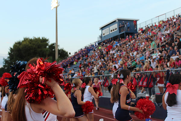 The cheerleaders entertain the students and families in the Darwin Boothe Stadium on Thursday, September 7 before the game starts. The cheerleaders kept their school spirit alive throughout the whole game.