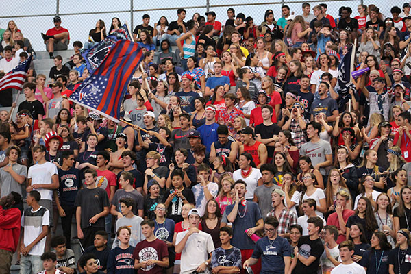 The student section in the Darwin Boothe Stadium, on Thursday, September 7 cheers as the football team scores their first touchdown. “I love going to the football games,” junior Serena Ahmed said. “I love the excitement.”