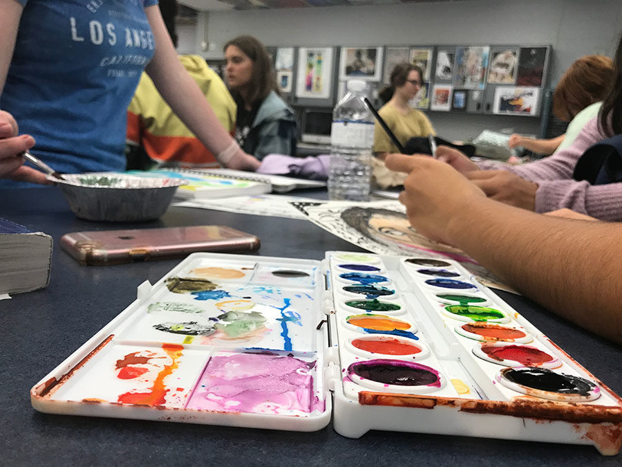 Members of the National Art Honor Society utilize water colors to complete their sketchbooks on Friday, Oct. 6. Students are required to “get creative” and experiment with different mediums in their sketchbooks. 
