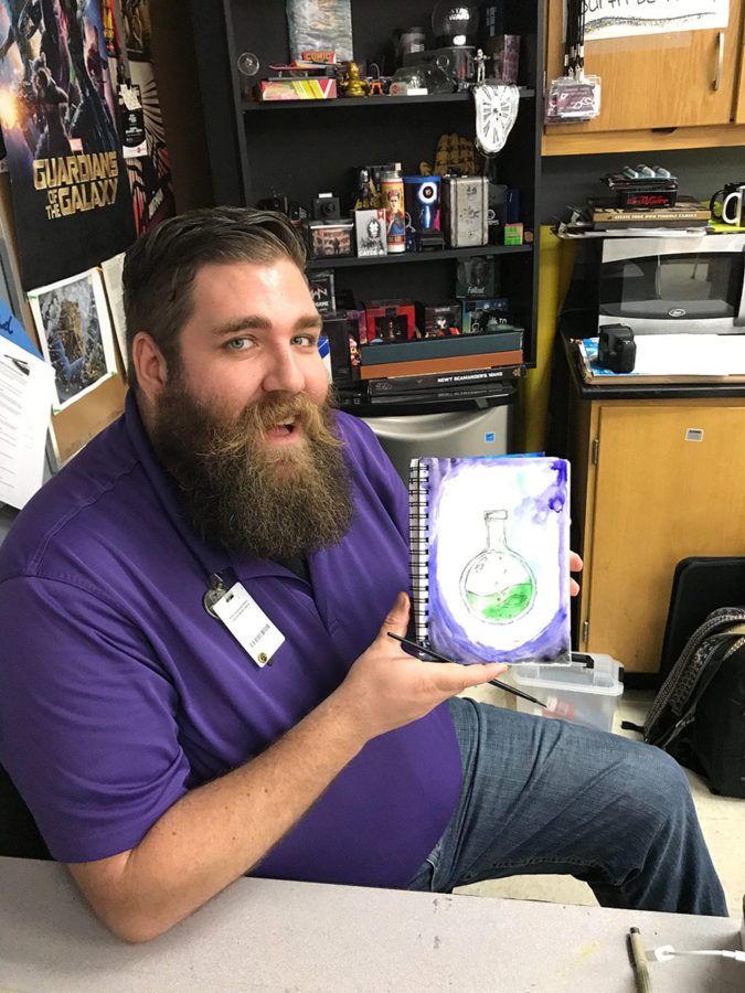 Photography teacher Alex Garver displays his piece for Inktober day three, poison, during class on Thursday, Oct. 5. Garver challenged his photography students to apply the words to their photos or to even begin inking themselves. 
