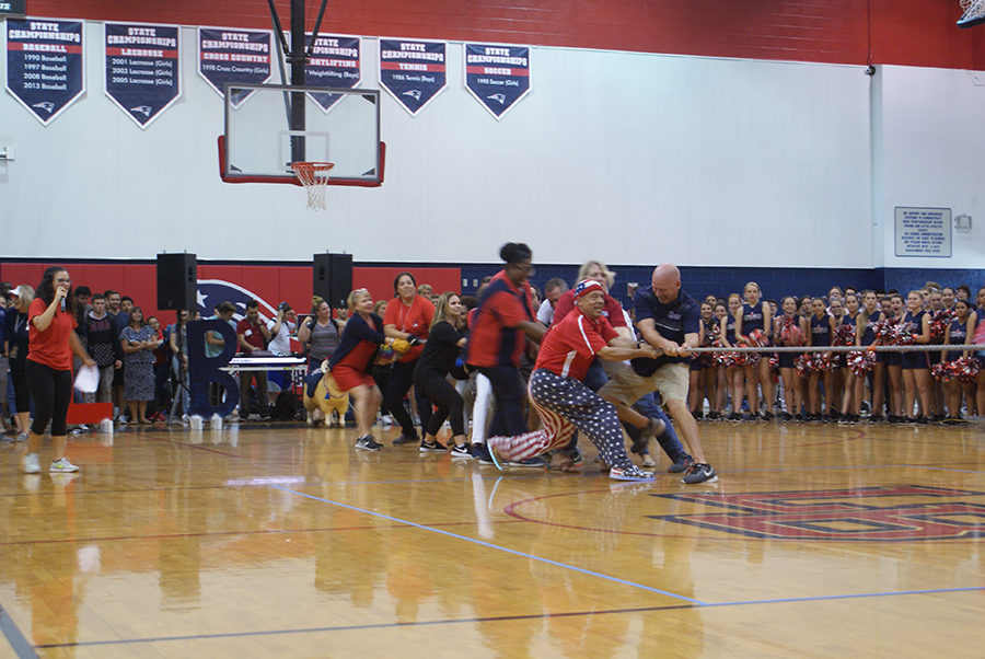 Teachers pull the rope over to their side during the “tug o war” match towards the end of the pep rally on Thursday, September 28 in the main gym. The teachers competed against their children, who are students at Lake Brantley High School.