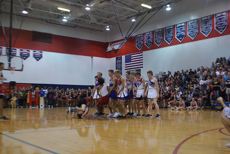 One of the powderpuff cheerleaders acts as human bowling ball knocking down his fellow cheerleaders, who act as human pins, during their pep rally act on Thursday, September 28 in the main gym. The crowd went wild as all the human “bowling pins” fell to the ground.