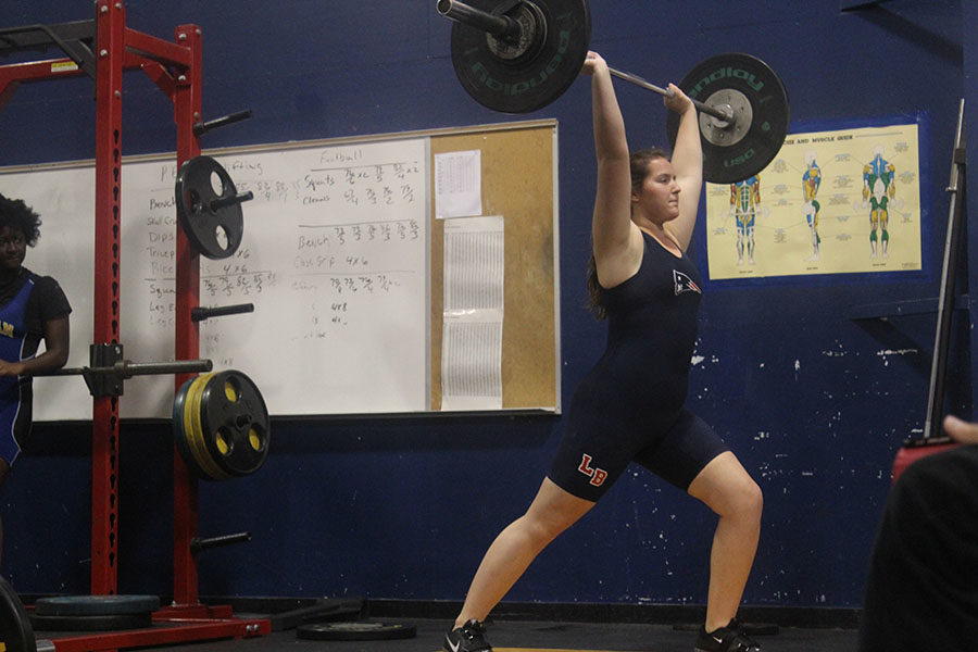 Sophmore Ashley Weinstein lifts 95 pounds using the technique called clean and jerk on Wednesday, Nov. 1. Lake Brantleys weightlifting team suffered a loss by eight points against the Lyman Greyhounds.