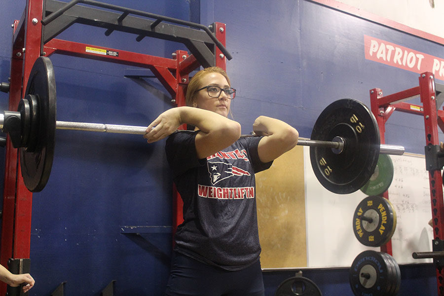 Junior Jordan Cannizzaro practices her lift before the meet starts on Wednesday, Nov. 1 at the Lake Brantley south gym. The meet started at 4 p.m. and ended roughly around 6 p.m.