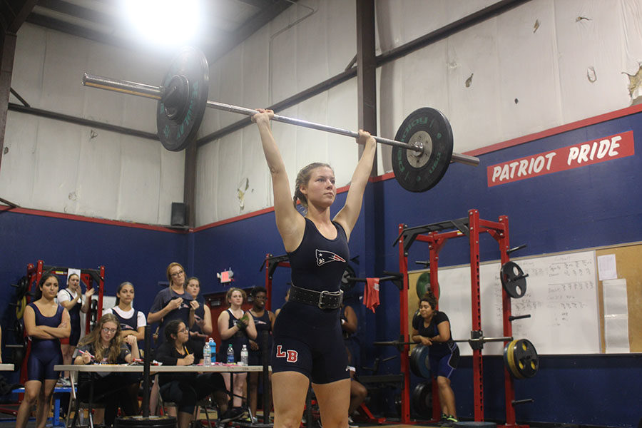 Senior and team captain Liberty Ballard completes a lifts. The heaviest lift that she lifted on Wednesday, Nov. 1, was 205 pounds.