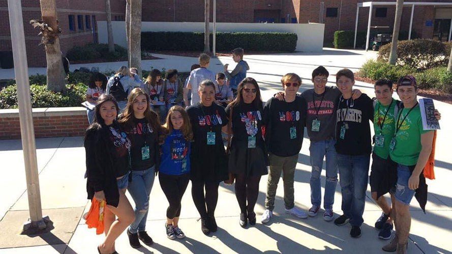 At Lyman High School, on Nov. 16, many of the seniors get together for a photo at their last District Competition. Troupe 2888 members waited outside Lyman’s auditorium before the performances to find seats before the One Act performances began.