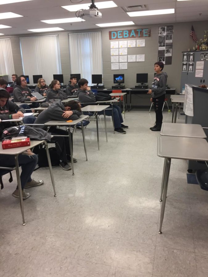Senior Grace Staudenmaier practices her compelling debate on her classroom audience. Staudenmaier has been a top performer in her debate competitions, where she has come in first and third places.