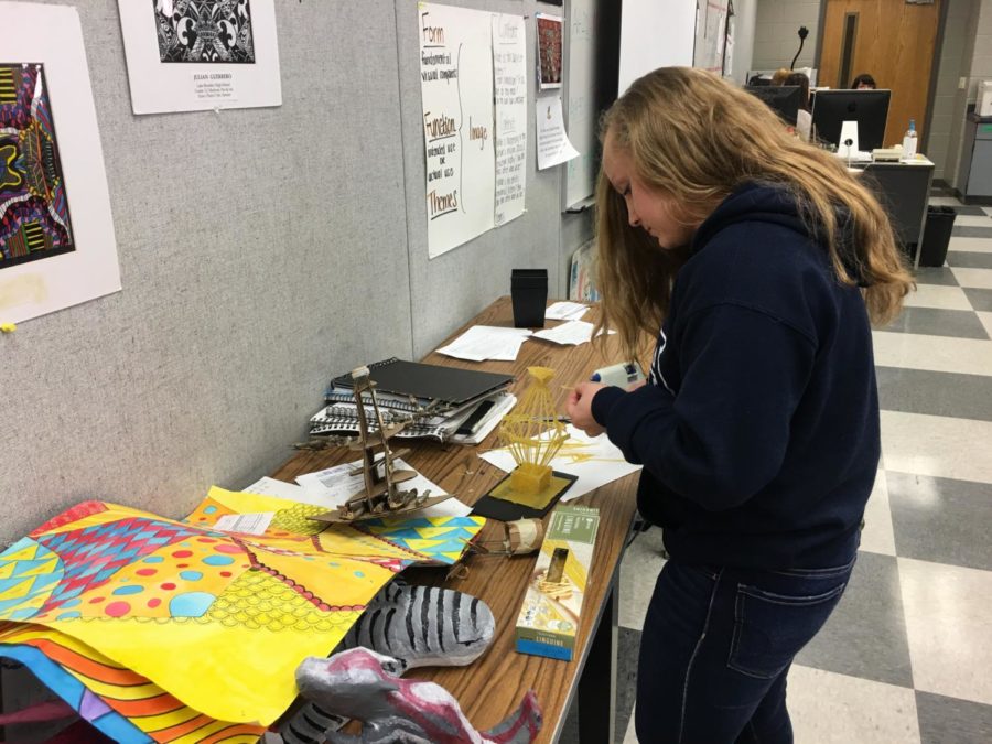 Sophomore Jennifer Simon creates a 3-dimensional tower piece for her 3D art class, led by teacher Ashley Buxton in room 6-105 on Thursday, Jan. 18. “I think [art] is a good place for kids who struggle academically because then they can come into the art room and it’s like their place,” Buxton says. “It gives them a room to explore where they feel comfortable.”