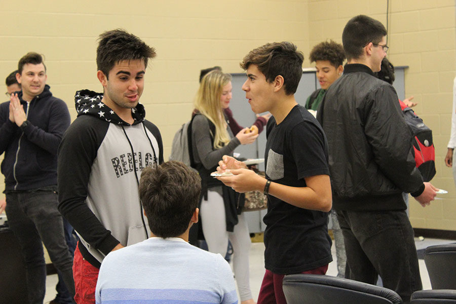 In the community room, at the end of The Anthem Club, on Tuesday, Jan. 16, students participate in a donut social to get to know each other. Members enjoyed Krispy Kreme donuts while socializing with each other.

