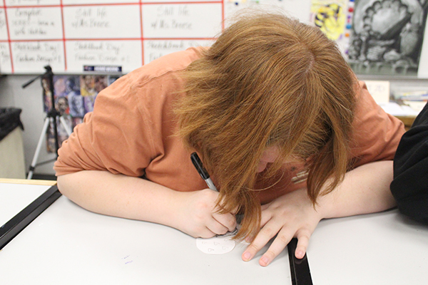Sophomore Aubree Wilkes, a member of Star wars club, participates in the card making activity in room 7-105 after school on Friday. Feb. 23. The two sponsors of the clubs, art teacher Kathryn Farmer and photography teacher Alex Garver, thought it was important to gather their students and demonstrate their support for the Parkland students.