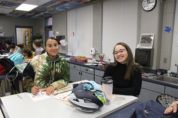 Juniors Andreina Teixeira and Rebecca Calderon are attending the art club meeting on Friday, Feb. 23 after school in order to create cards and send to the victims of the Parkland students. Students created a joint effort in order to show Lake Brantley’s   community support for the Douglas community.
