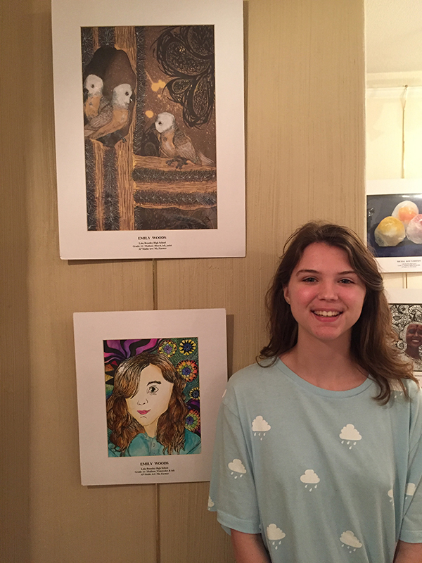 On Friday, Feb. 2 junior Emily Woods attends the AP underclassmen show at Casselberry in order to view her work, along with other Seminole County artists. Woods attended the opening night of the event in order to support her fellow young artists. 