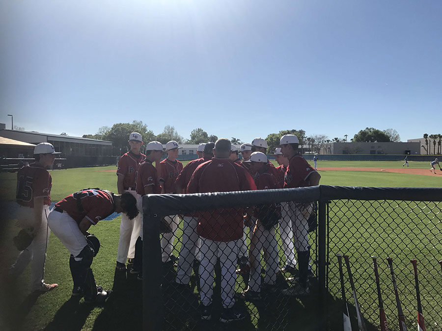 Lake Brantley JV White huddles up between innings in their game at Dr. Phillips. They would later go on to get an easy 6-1 win, winning their second game of the season.