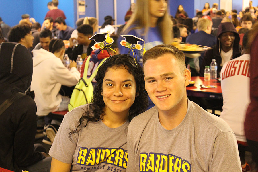 Seniors Julia Rentas and Gabe Servi pose together at their table on Friday, Apr 6 during senior breakfast in the cafeteria. (quote)