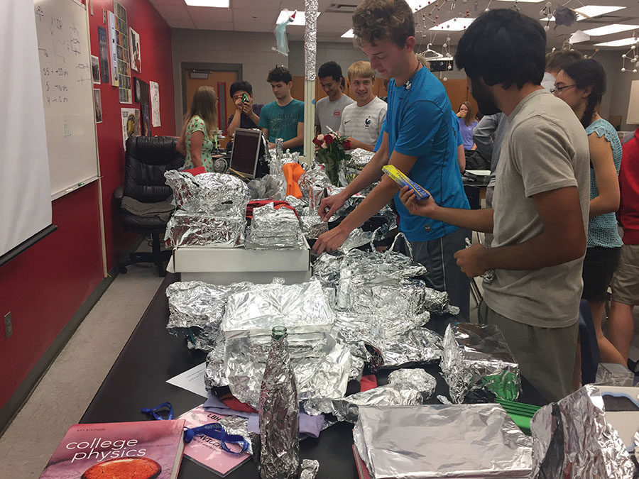 On the morning of Tuesday, May 8, Advanced Placement[AP] Physics I teacher Dina Cavicchia provides breakfast prior to the AP National in room 8-122. The students were also tasked with uncovering all of her items which they had wrapped in aluminum foil while she had been away, this provided a relaxed and carefree environment prior to the AP exam.
