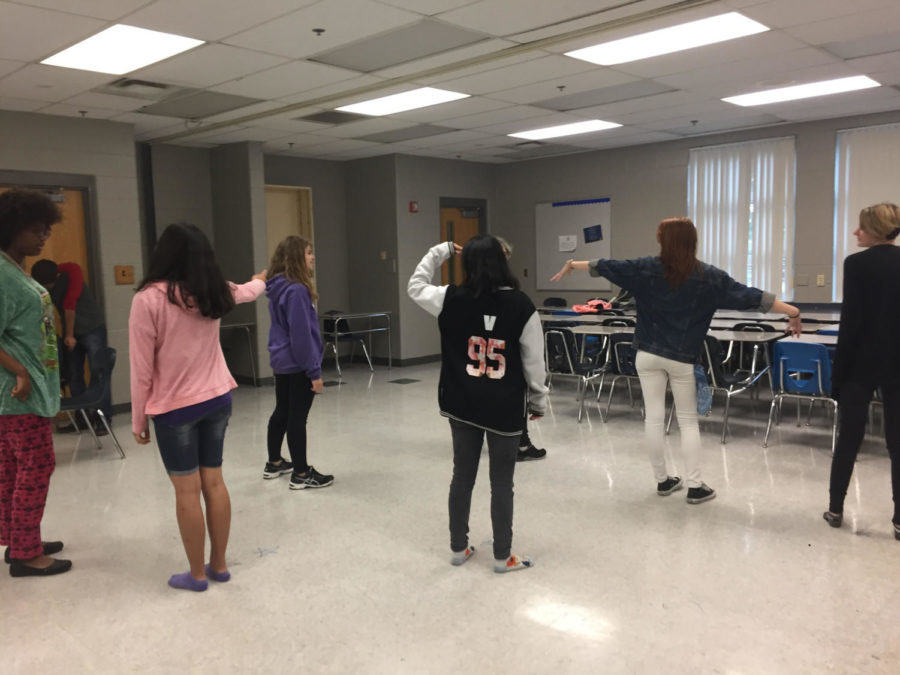 On Thurs., May 17, in room 6-205, members of the K-Pop Club stand in their starting poses for their dance performance. On this day, the members were rehearsing the choreography to the song “Mic Drop,” by the band BTS.


