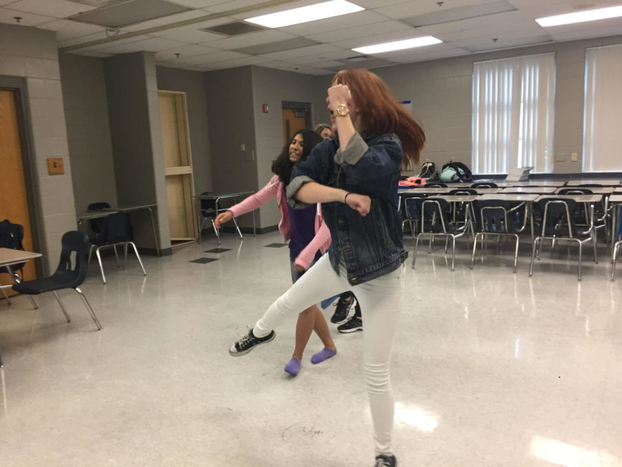 Sophomore Hailey Timpe jumps to the song “Mic Drop” by BTS on Thurs., May 17 in room 6-205 after school. While practicing the dance to this song, members of the K-Pop club were able to learn new dance moves that are prominent throughout popular K-Pop music videos.