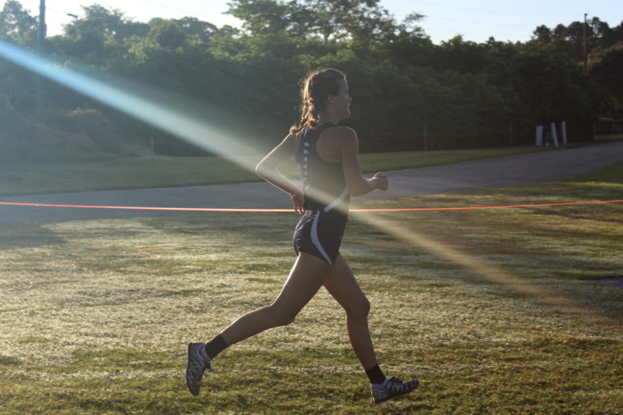 Junior Ashley Klingenberg runs in the Sept. 1 Deland Invitational cross country meet and places first among 136 varsity participants. The girls varsity team received first place and holds a state ranking. 
