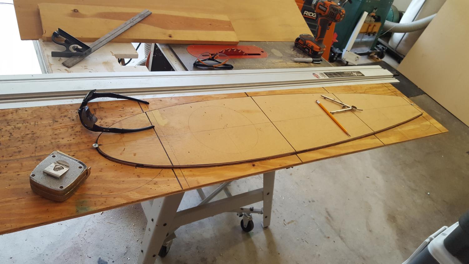 A plank of wood sits on a work bench in freshman Thomas Morris's garage,