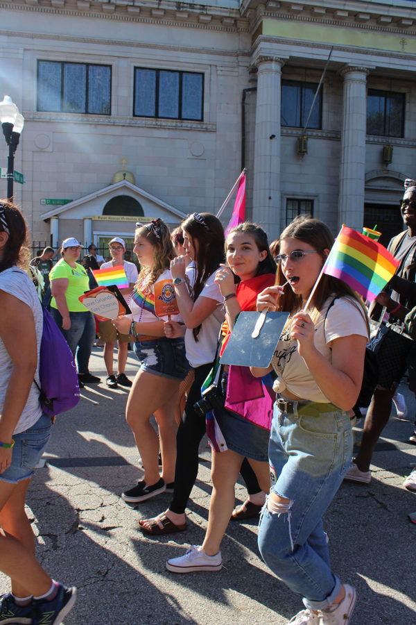 Sophomore Emily Kirsch and sophomore Erin Hueguenin of the Lake Brantley Gay Straight Alliance(GSA) walk in parade with other GSA groups from Central Florida. The LGBT+ community and allies celebrated Orlando Pride on Saturday, Oct. 13, at Lake Eola from 10 A.M. to 10 P.M..