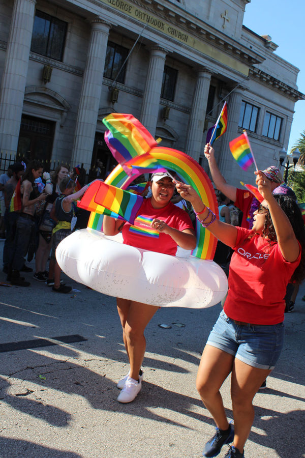 Oracle workers adorned in rainbows and floats walk the parade and dance with the crowd during Orlando Pride. The LGBT+ community and allies celebrated Orlando Pride on Saturday, Oct. 13, at Lake Eola from 10 A.M. to 10 P.M..
