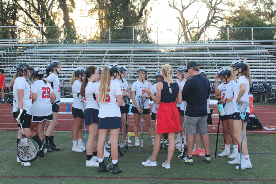 On Monday, March 4 the junior varsity team listens to their coaches as they prepare them for their game and inform them of the different plays that they should be enacting. The junior varsity and varsity girls lacrosse teams played against Winter Park High School in Darwin Boothe Stadium with the junior varsity team winning at 10-4 and the varsity team losing at 8-10. 