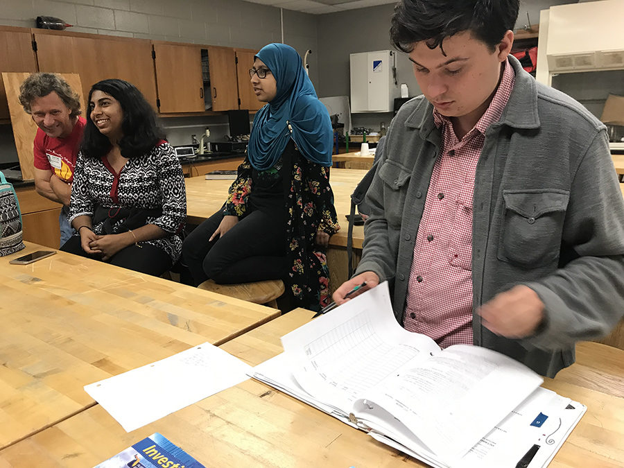 Senior George Howe signs members of the Junior Optimist International Club on Jan. 23 2019. 