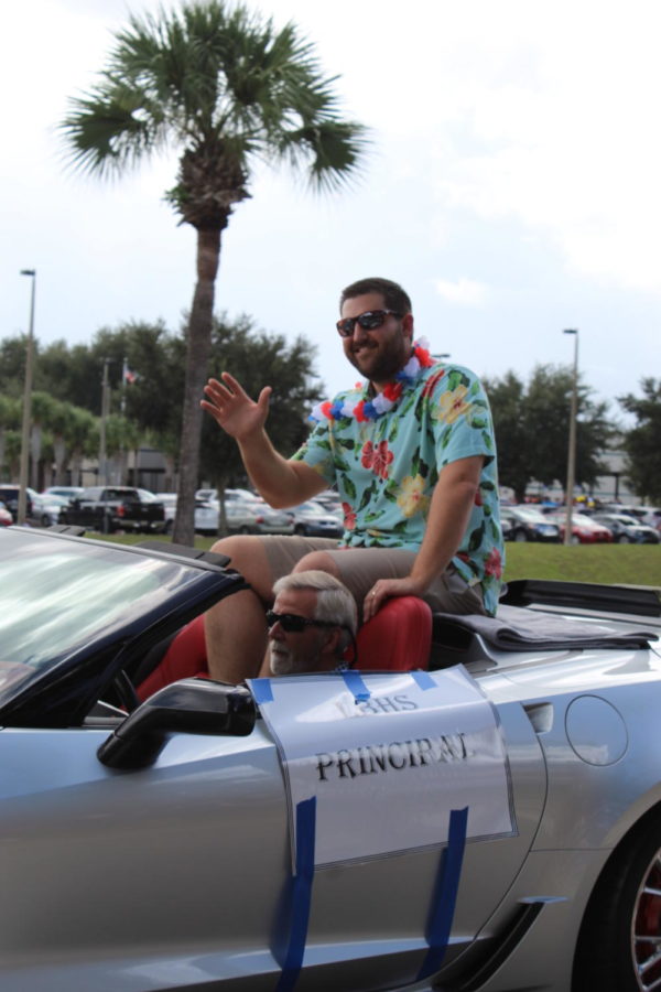 Principal Brian Blasewitz rides in a Corvette on Thursday, October 10 in the homecoming parade. This was Blasewitz’s first homecoming parade at Brantley.
