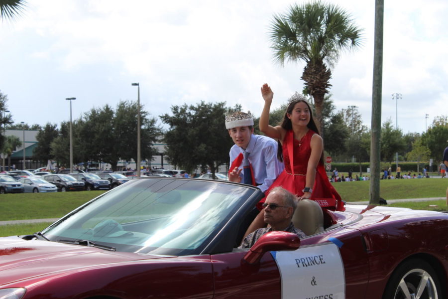  Homecoming Prince and Princess Annamarie Nieves and Colin Grossman ride in a red Corvette on Thursday, October 10 in the homecoming parade. It is a tradition for the prince and princess to be seniors that school year.