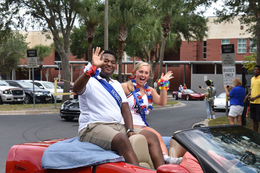 Senior Homecoming Court Trey Langston and Emily Vincent ride in a corvette on Thursday, October 10 in the homecoming parade. There were a total of 11 corvettes in this years parade.