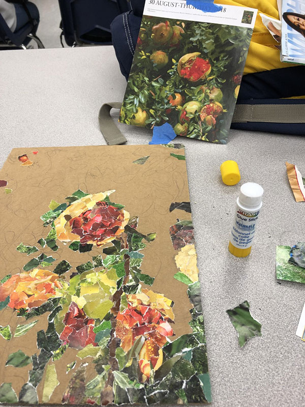 On Feb. 27 students are working on a collage project. This student is recreating a painting of pomegranates. The process of magazine pieces and gluing is shown. “This project helps me work on simplifying the process of making art,” Isabella Sanders said. “It also helps me think about the most important details.”