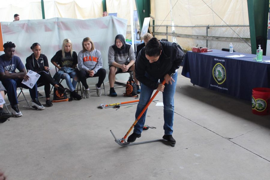 An employee of Florida Transportation Builders Association, Inc. demonstrates how to properly use a pipe bender. Following the demonstration, the students then separated into groups and had the opportunity to test it out for themselves.